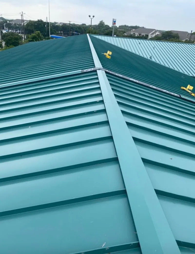 Green commercial metal roof ridge and valley for Metal Roof Repair in Dracut