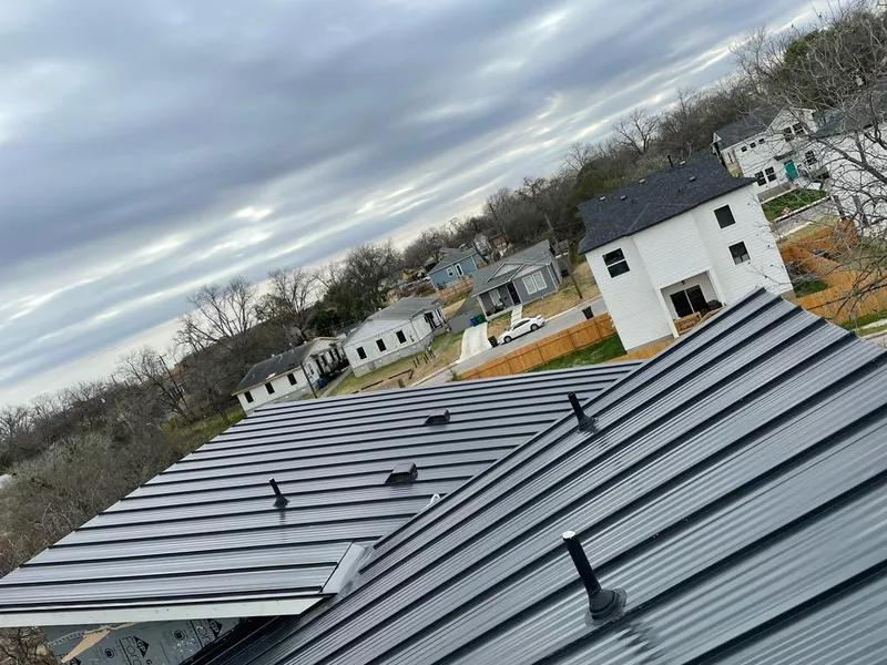 Standing seam metal roof panels with vents for Skylight Repair in Dracut